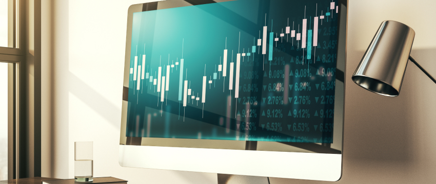 A computer screen displaying a candlestick chart with fluctuating stock prices, highlighting algorithmic trading tools. The setup conveys a professional and analytical atmosphere.