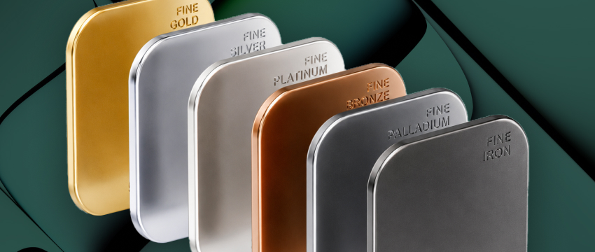 3D render of various commodity bullion bars labeled fine gold, silver, copper, and aluminum, representing some of the most popular metals to trade in financial markets.