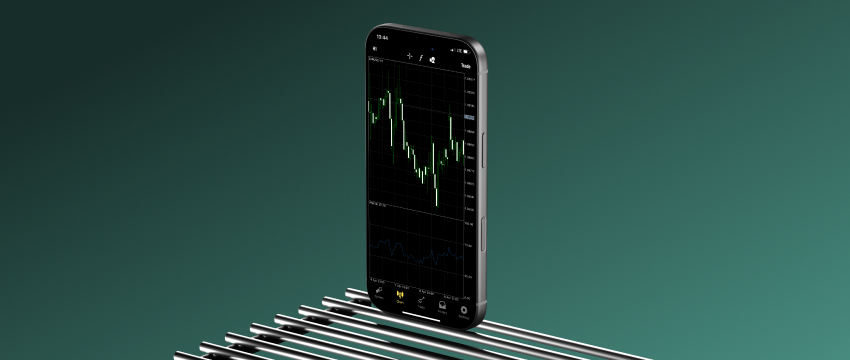 A smartphone displaying a green and white candlestick chart sits on a metal rack against a deep green background, illustrating how to maximize The Compounding Effect in trading accounts.