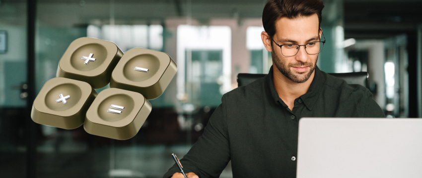 Man sitting at a desk working on a laptop near a 3D Interest Rate Calculator icon representing financial returns and growth analysis.