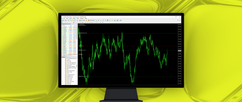 MetaTrader 4 platform on a monitor showing a forex price chart and currency pair list
